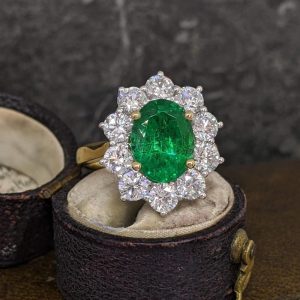 An Impressive Emerald and Diamond Cluster Ring - 2.6ct Emerald