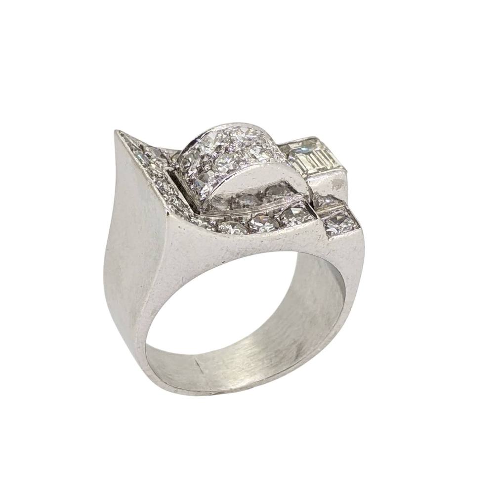 Silver mens ring with a bold, sculpted top encrusted with small diamonds at the curves and edges, chrome finish